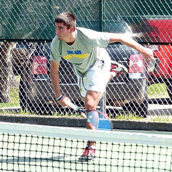Elliot Schneider won No. 2 singles as St. Scholastica won 8-1. Photo credit:  John Gilbert