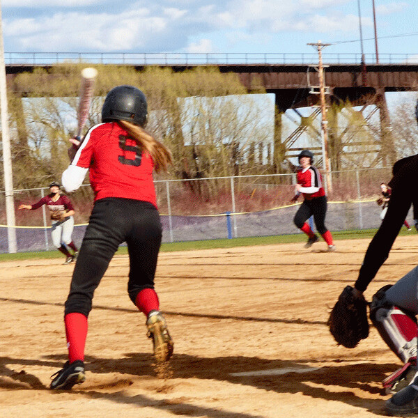 Duluth East’s Maggie Robinson hit a pop-up toward second with two out in the seventh inning,  but when the ball was dropped, an appeal led the umpires to rule interference on the  East baserunner -- third out, Denfeld wins 10-9. Photo credit: John Gilbert