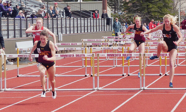 UMD senior Danielle Kohlway, at left, cleared the last hurdle and raced to victory in the  100-meter hurdles to win the NSIC event and qualify for the NCAA. Photo credit: John Gilbert