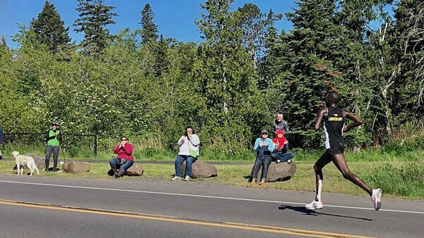  Boniface Kongin's long legs and long stride had him on a record pace as he ran off from the Grandma's Marathon pack, and he held on to win.