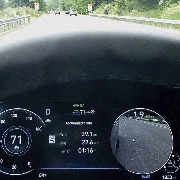 Hit the blinker for a lane change and the tachometer becomes a side-camera  safety view of the next lane. Photo credit: John Gilbert