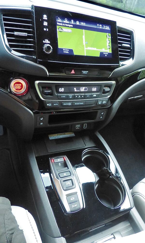 The nav screen and the console discloses the complex but workable shift box for  Passport’s push-button transmission. Photo credit: John Gilbertt
