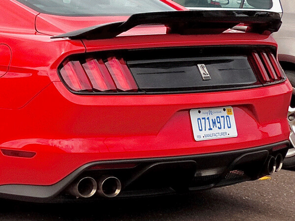 The distinctive tail is adorned with a wing, and a Cobra emblem on the Shelby GT350, and the quad pipes like the switchable exhaust. Photo credit: John Gilbert