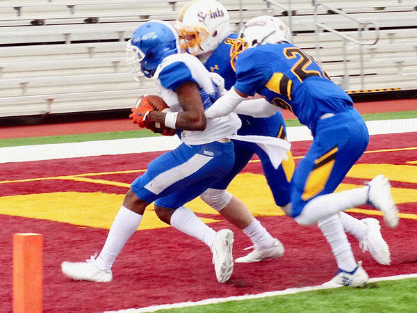 Mayville State's Jacquante Pitts caught a 23-yard touchdown pass, one of three he caught among 9 receptions for 150 yards, gaining a 35-21 lead over St. Scholastica. Photo credit: John Gilbert