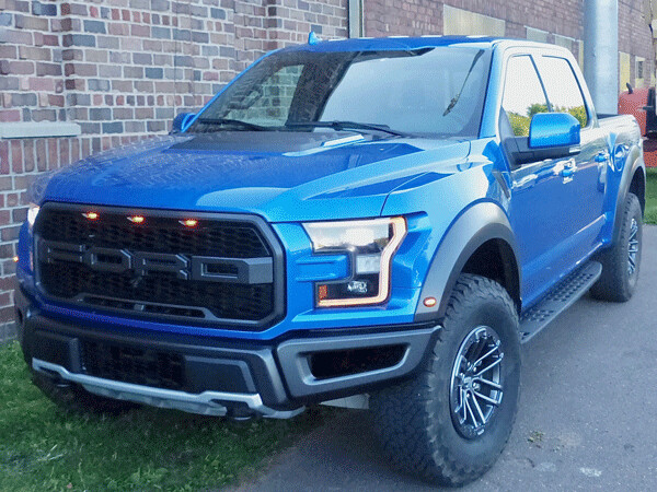 Widened F150 takes on entire new personality as the 450-horsepower Raptor. Photo credit: John Gilbert