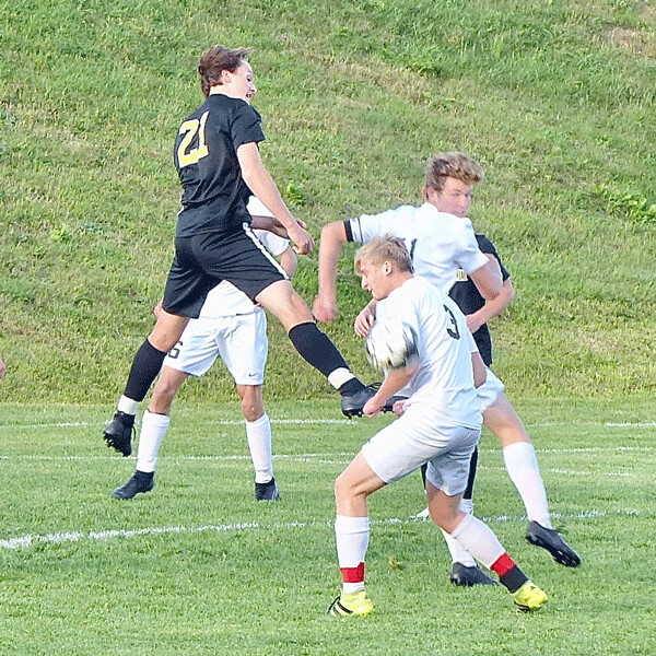 Marshall defender Blake Bachand went high to clear a Duluth East threat with a header during East's 2-0 victory last week. Photo credit: John Gilbert