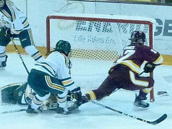 UMD sophomore Gabbi eHughes (17) turned Clarkson goaltender Marie-Pier Coulombe inside out before scoring the first goal - again - in Satuirday's 2-0 victory. Photo credit: John Gilbert