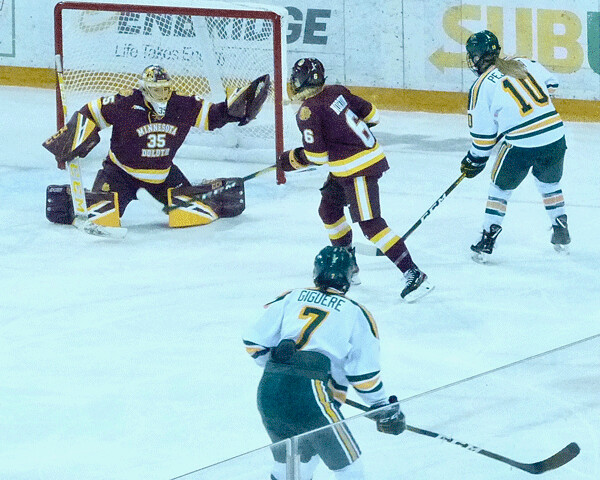 Michaela Pejzlova arrived in time and uncovered to put a rebound past UMD goalie Maddie Rooney for the winning goal in Friday's 4-2 Clarkson victory. Photo credit: John Gilbert