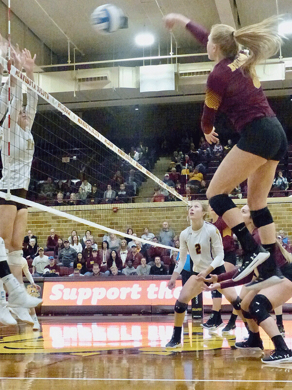UMD's Kate Berg soared high to blast one of her team-high 15 kills in the 3-2 victory over Southwest Minnesota State Saturday.  Photo credit: John Gilbert