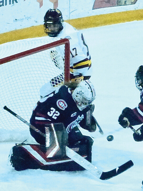 Gabbie Hughes was foiled by St. Cloud goalie Emma Polusny in Friday's 3-2 UMD victory during their WCHA sweep.  Photo credit: John Gilbert