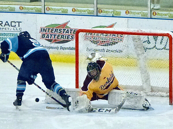 Denfeld goaltender Jacob Snyder split to get his right toe in the way to stop a breakaway by Superior's Gunnar Hansen, as the Hunters rallied for two third-period goals for a 3-2 victory. Photo credit: John Gilbert