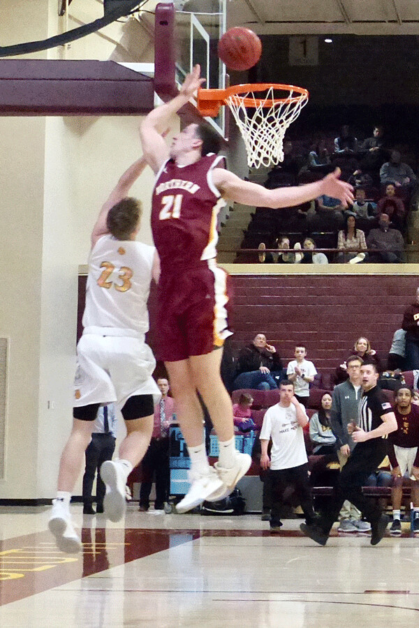 Northern's Gabe King scored 24 points, and loomed large above UMD's Mason Steffen. Photo credit: John Gilbert