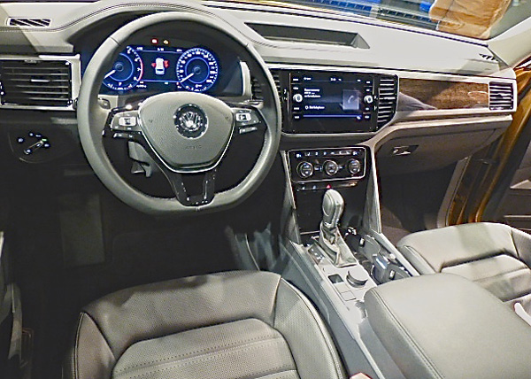 Driver's view shows clean instrumentation and luxurious wood and leather interior. Photo credit: John Gilbert