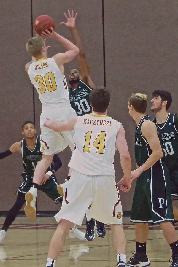 Jake Wilson went up for a jump shot and made 11 points as UMD’s bench outscored 9-1 Wisconsin-Parkside 39-25, but the 1-9 Bulldogs lost 85-76 Monday at Romano Gym. Photo credit: John Gilbert