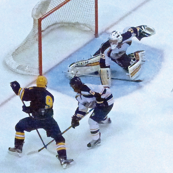 Often unheralded, Hermantown goalie Luke Olson smothered a shot by Will Torgerson (9) during his 5-0 championship game shutout. Photo Credit: John Gilbert