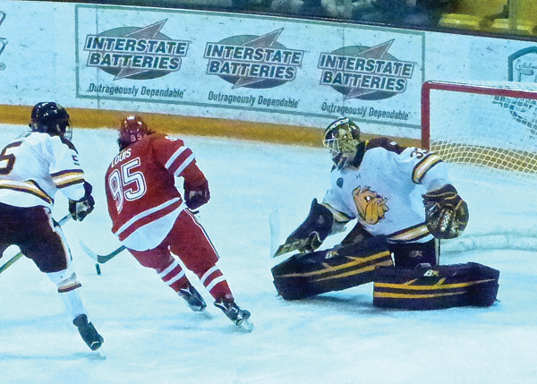 UMD sophomore goaltender Kasimir Kaskisuo came up with a big save on a short-handed breakaway by Miami’s Anthony Louis, igniting a 3-goal rally by the Bulldogs in the first game.  Photo credit: John Gilbert