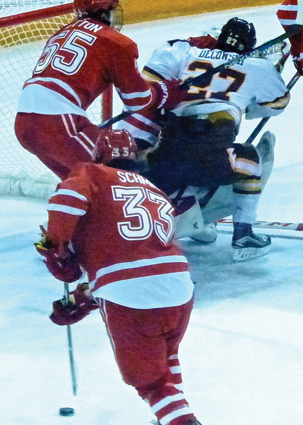 UMD’s Cal Decowski appeared to crash into Miami goalie Jay Williams in the second playoff game, but drew a penalty on the play. Photo credit: John Gilbert