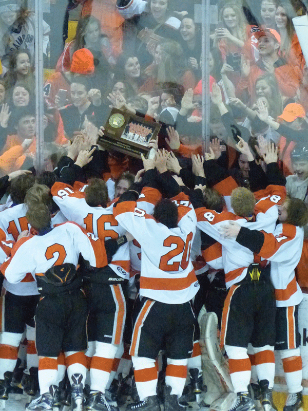 Jubilant Grand Rapids players took their Section 7AA trophy to celebrate with their fans at AMSOIL Arena. Photo credit: John Gilbert