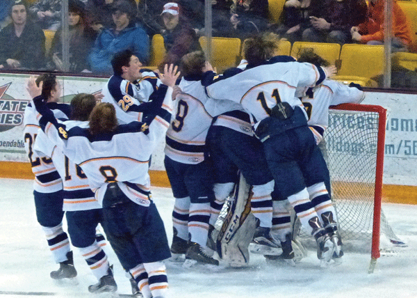 Hermantown players piled out to celebrate 8-0 Section 7A victory over Hibbing-Chisholm at AMSOIL Arena. Photo credit: John Gilbert
