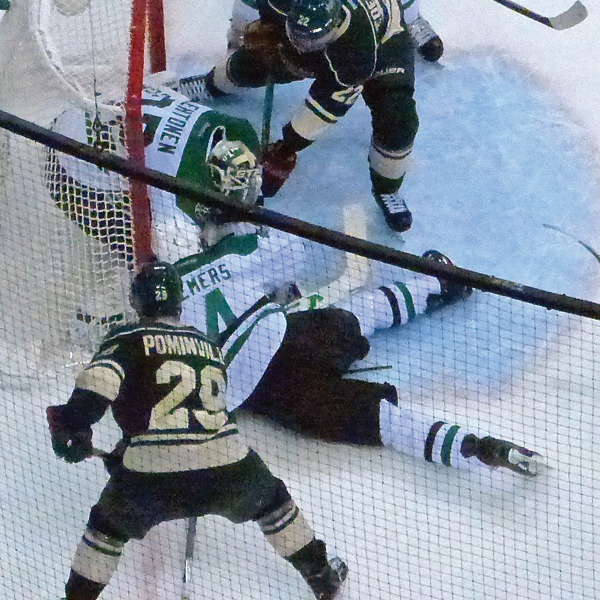 Rules say covering the puck in the crease calls for a penalty shot, but in this case, Demers merely saved a goal -- and ended the Wild season. Photo Credit: John Gilbert