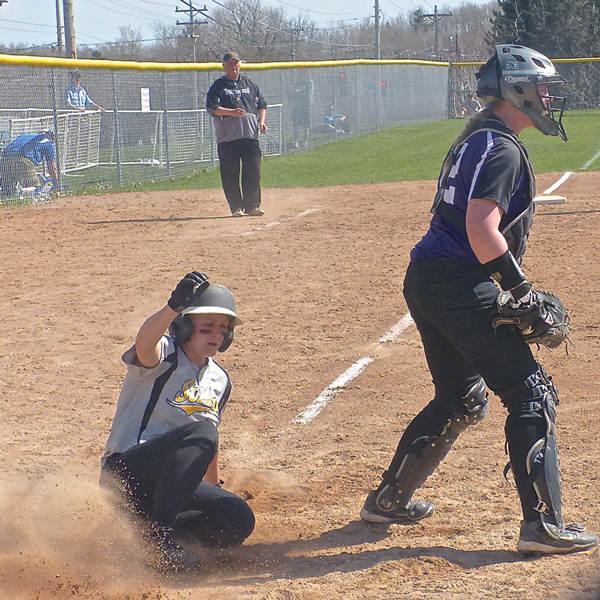 Katie Wilkie slid home with the winning run in the 8th inning of the 7-6 UWS victory over Northwestern.