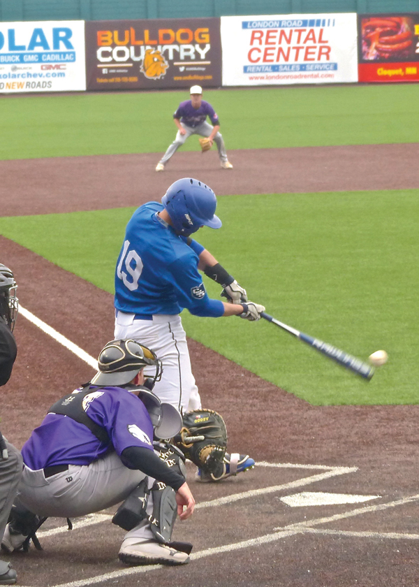 St. Scholastica's Jake Kuschke ripped a bases-loaded hit in the UMAC final against Northwestern, boosting the score from 6-3 to 9-3.  Photo credit: John Gilbert