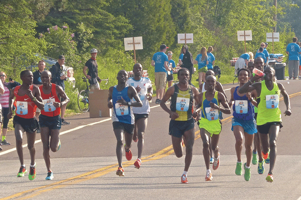 Elisha Barno, far left, kept a wary eye on his top competitors after the first four miles of Grandma's. Photo credit: John Gilbert