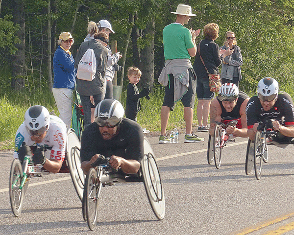 High humidity slowed times and sent a record number of runners for medical assistance at Grandma's, but nothing could slow the missile-like wheelchair competitors as they sailed along Hwy. 61 shortly after the start. Photo credit: John Gilbert