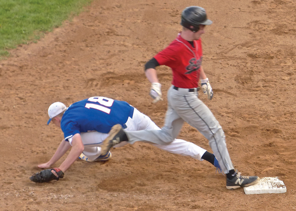 Junior John Chmielewski beat out an infield chop, and when the throw was wide and low, two runners scored to give East its 3-2 victory over Cambridge-Isanti. Photo credit: John Gilbert