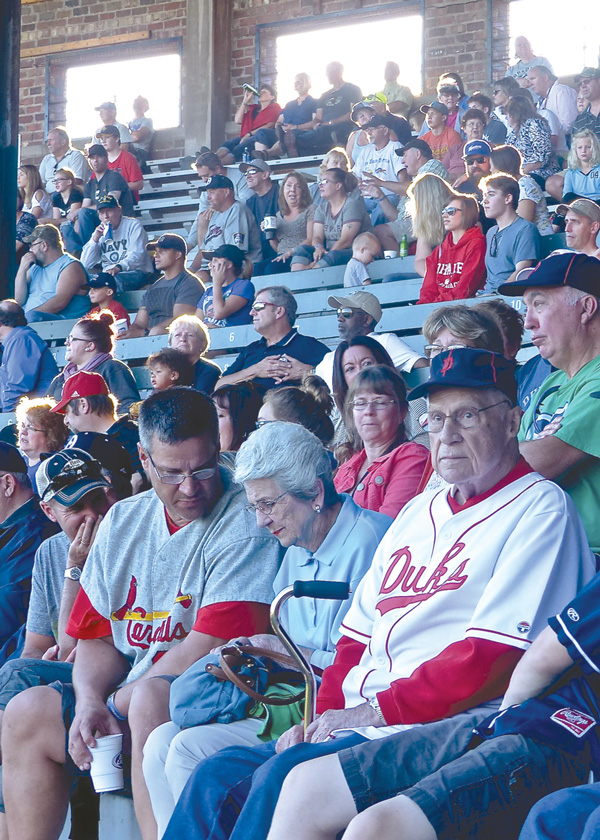 Bernie Gerl, who was a catcher who survived the 1948 Duluth Dukes bus crash, and his wife Bernadine and son, Chuck, sat amid the Wade Stadium crowd. Photo credit: John Gilbert