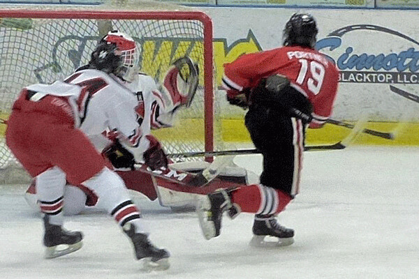 Lakeville North's Riley Portner finished off a 2-on-1 with a shot past East goalie Lukan Hanson's glove. Photo credit: John Gilbert