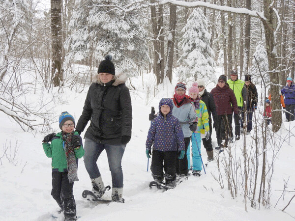 Our little group on the Family Snowshoe Hike appreciated the beauty of freshly fallen snow. Photo by Emily Stone. 
