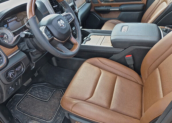 Plush leather seats and countless connectivity and computer storage bins fill the contemporary Ram interior. Photo credit: John Gilbert