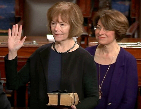 Senator Amy Klobuchar looks on as Tina Smith is sworn in to replace Senator Al Franken.  Both Smith and Klobuchar have publically stated that they are endeavoring to pass a bill that would override citizen due process rights by compelling the U.S. Forest Service to transfer public land to PolyMet for its open pit mine operations.