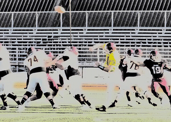 Ben Everhart, one of a cluster of UMD quarterbacks, fired a 25-yard pass to Nick Eliason for the White team in its intrasquad spring game against the Maroons. Photo Credit: John Gilbert