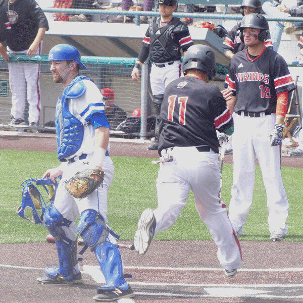 Saints catcher Cole Tyman showed a bit of the agony of defeat as Diego Martiarena -- one of seven beneficiaries of 9th-inning walks and one hit batter -- crossed home plate in the 10-run ninth. Photo credit: John Gilbert