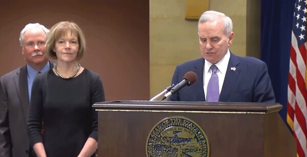 Governor Dayton (right) appoints Tina Smith to fill Al Franken’s senate seat, following his  resignation.  Tina is accompanied by her husband, Archie Smith, former Senior Portfolio  Manager at Rothschild Capital Partners LLC. Smith_Dayton_SM3