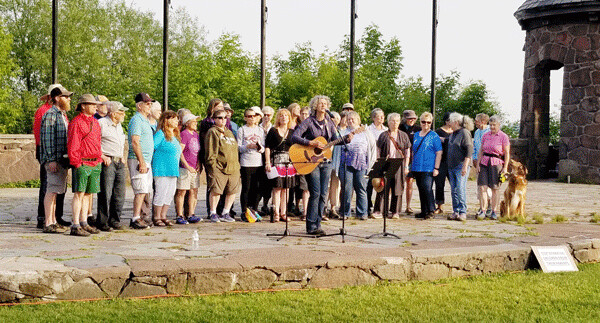 Sara Thomsen performs at a “Soulstice: A Celebration of Peace, Love and Democracy” at Leif Erikson Park at the same time as the Trump rally. Photo by Mary Stukel