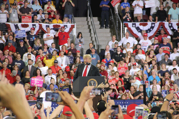 The president has a hard time keeping his eyes open at his own rally. Photo by: Richard Thomas