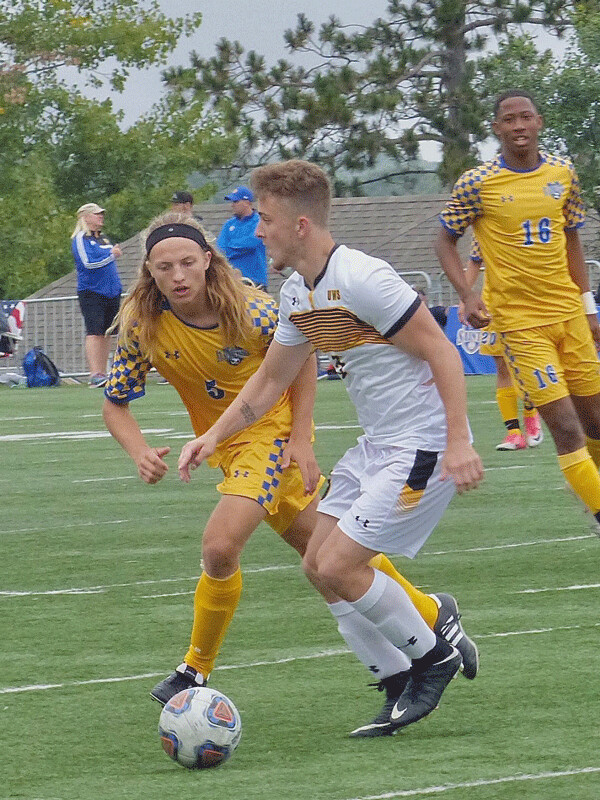 St. Scholastica’s Nolan Friday, a freshman from Duluth East, tried to get the ball from Wisconsin-Superior’s Mason Tynsky in the teams’ 1-1 tie. Photo credit: John Gilbert