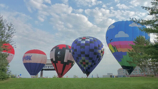 Bayfront Park was adorned by a fleet of hot air balloons just waiting for the evasive weather to cooperate. Photo credit: John Gilbert