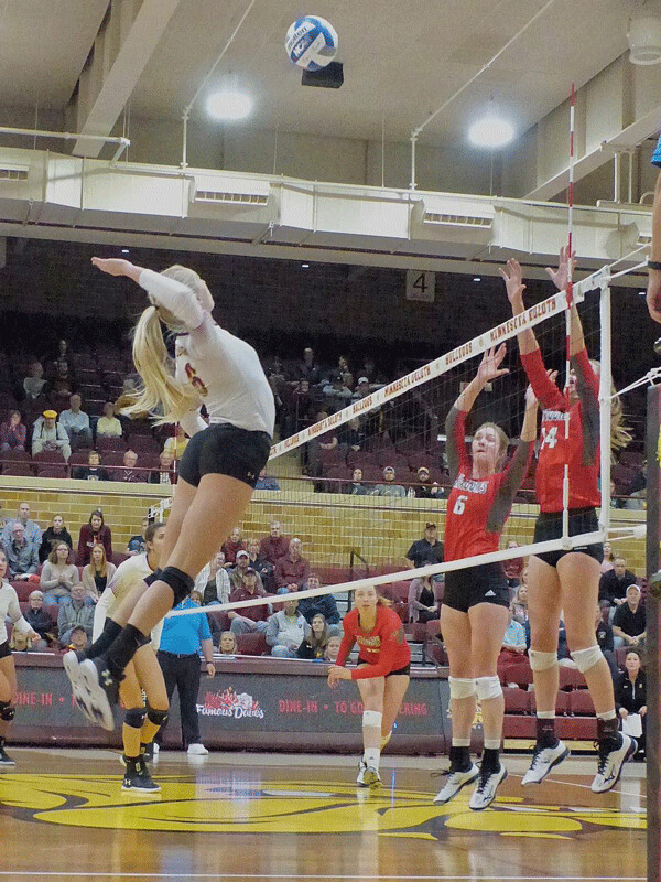 Hanna Meyer emerged in Sarah Kelly’s absence to soar out of the Romano Gym lights to deliver  21 kills against Moorhead Friday and 18 more against Northern Saturday. Photo credit: John Gilbert