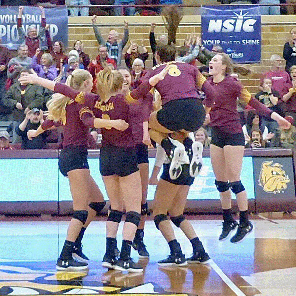 The Bulldogs erupted iin an emotional on-court celebration after winning the NSIC playoff championship 3-1 over Southwest State, led by Makenzie Morgen's high jump. Photo credit: John Gilbert
