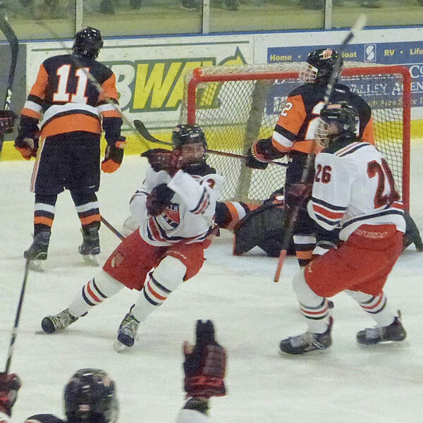 David Holliday (13) peeled off after his third-period goal lifted Duluth East to a 4-3 lead after trailing White Bear Lake 3-0. Photo credit: John Gilbert