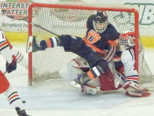 Lleyton Roed, who scored White Bear Lake's second goal and set up the third, crashed heavily into Duluth East goalie Lukan Hanson in the third period. Photo credit: John Gilbert