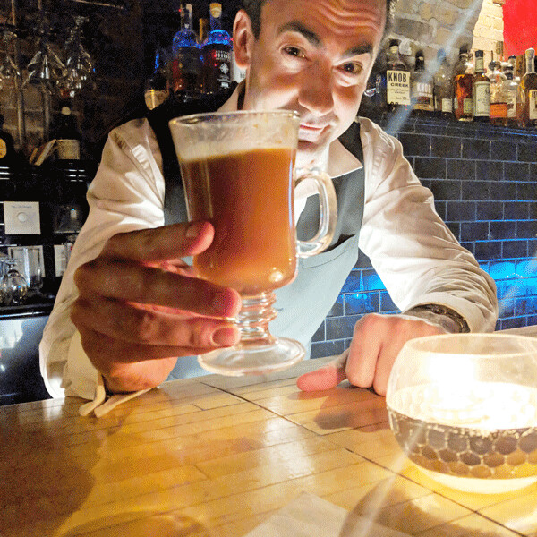 Kai Soderberg shows off the hot buttered rum - photo by Felicity Bosk 
