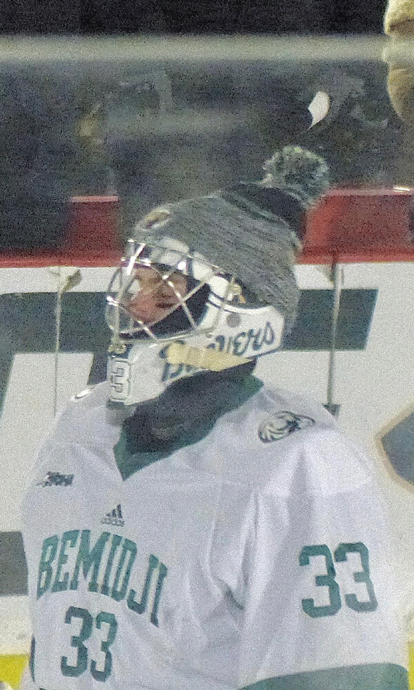 Bemidji State goalie Zach Driscoll knew that warm-ups meant more than usual with  29-below temperatures at the Hockey Day  Minnesota outdoor rink in Bemidji.  Photo credit: John Gilbert
