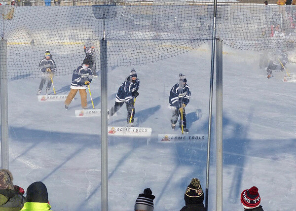 Kids from Bemidji youth teams hustled out to scrape the outdoor rink in perfect formation.  Photo credit: John Gilbert