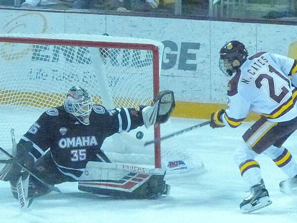 Strike 2:  UMD freshman Noah Cates got another chance as the puck fell to the ice, but couldn't get this one, either. No matter; the Bulldogs won 7-2 Friday night. Photo credit: John Gilbert