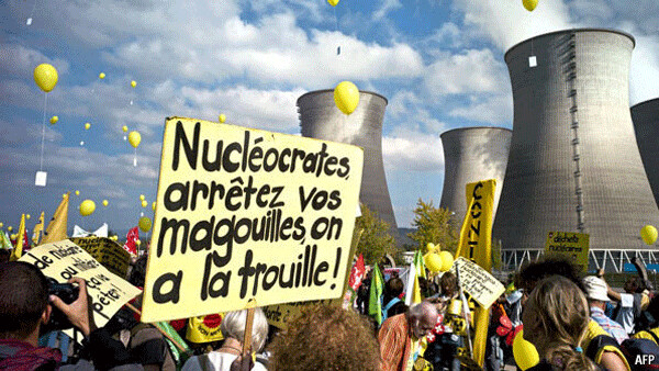 French protestors march against water-wasting reactors. The placard reads: “Nucleocrates,  stop your shenanigans, we are scared!”